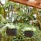 Glitzhome® 30" Black Solar Lighted Hanging Plastic Planters, 2ct.